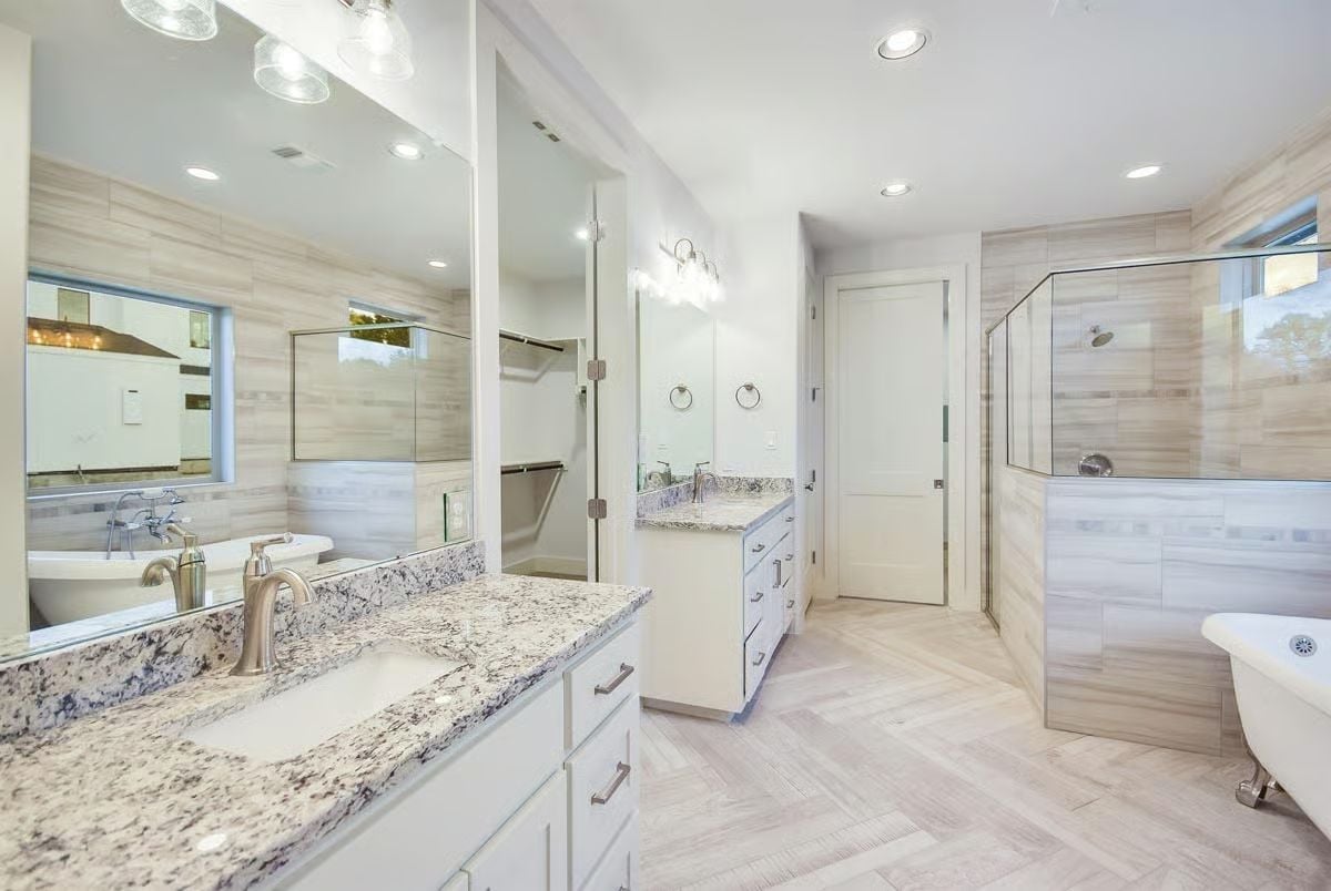 Granite Countertops and a Clawfoot Tub Share Space Without Competing