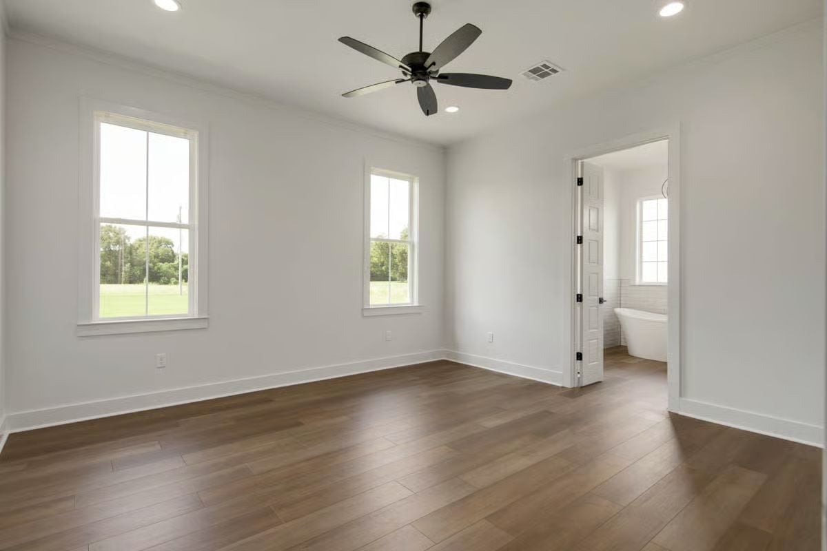 Matte Black Ceiling Fan, Freestanding Tub Visible Through the Door
