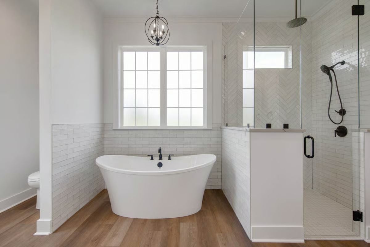 Matte Black Fixtures Pull a Freestanding Tub and Glass Shower Into One Conversation