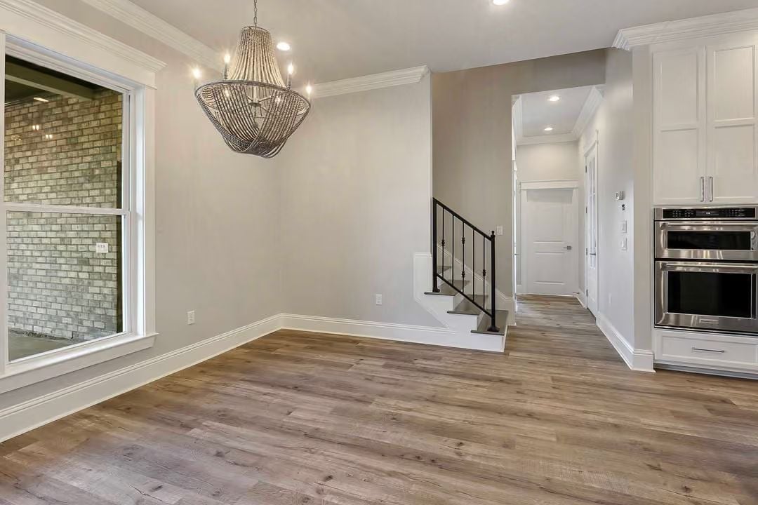 Beaded Chandelier and Wide-Plank Floors Set the Tone Before Furniture Arrives