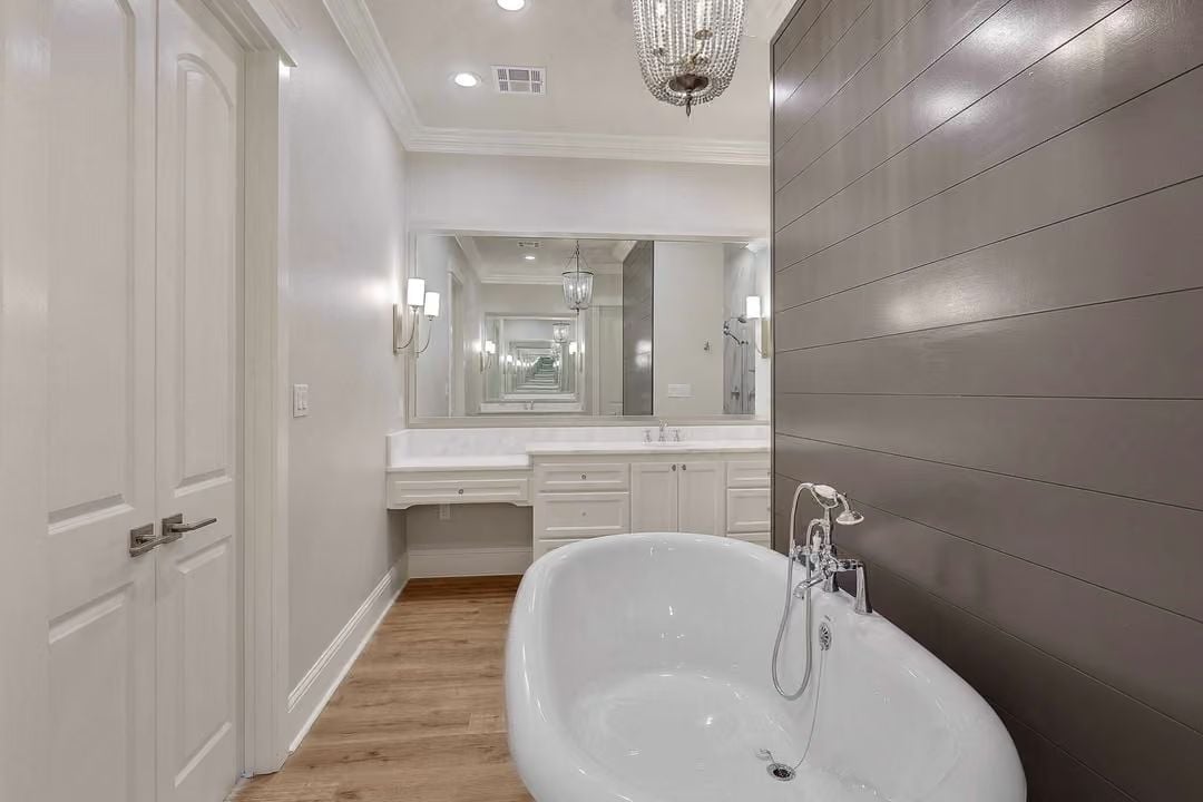 Chrome Filler Faucet and Freestanding Tub Positioned Against Shiplap That Actually Works