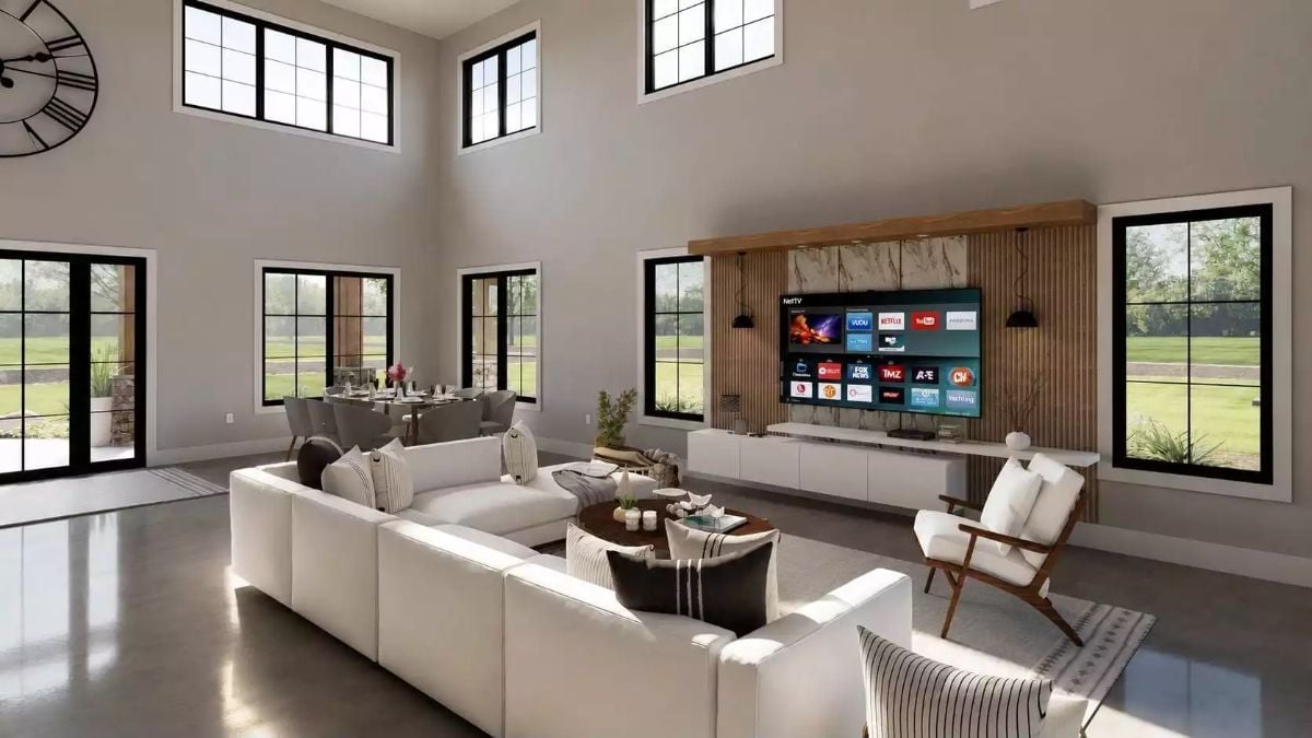 Concrete Floors, White Sectional, and a TV Wall That Earned Its Square Footage