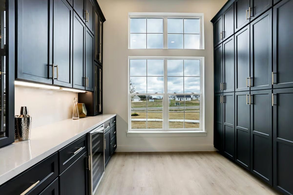Dark Cabinets, Double Windows, and a Pantry Built to Handle Serious Volume