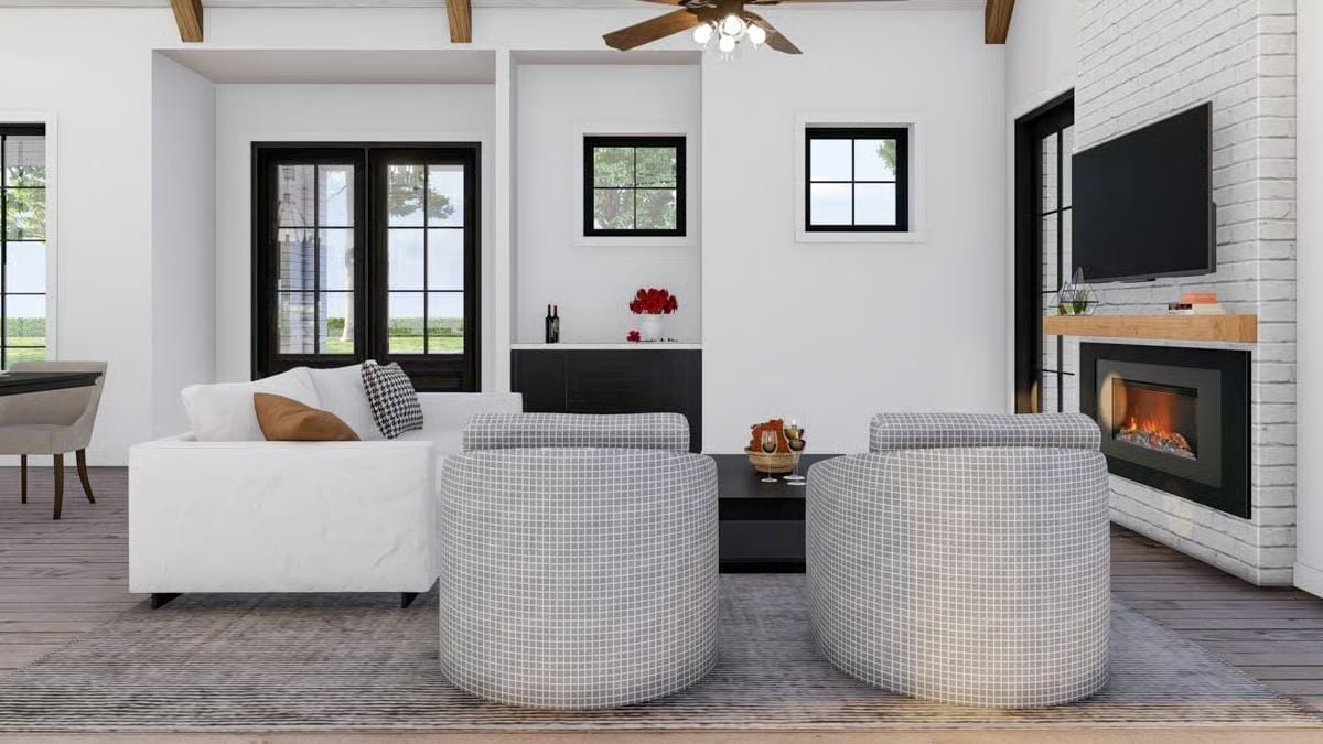 Barrel Chairs and a Linear Fireplace Make This Living Room Work Hard