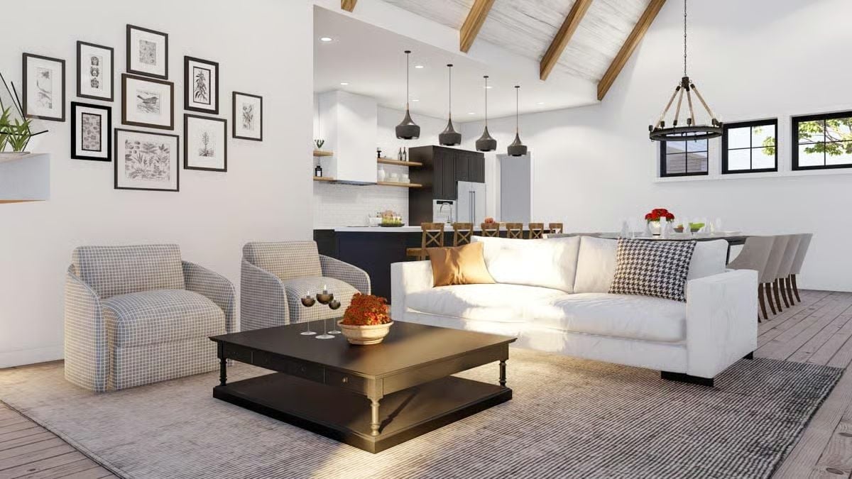 Exposed Rafters and a Dark Kitchen Island Anchor This Open-Plan Living Space