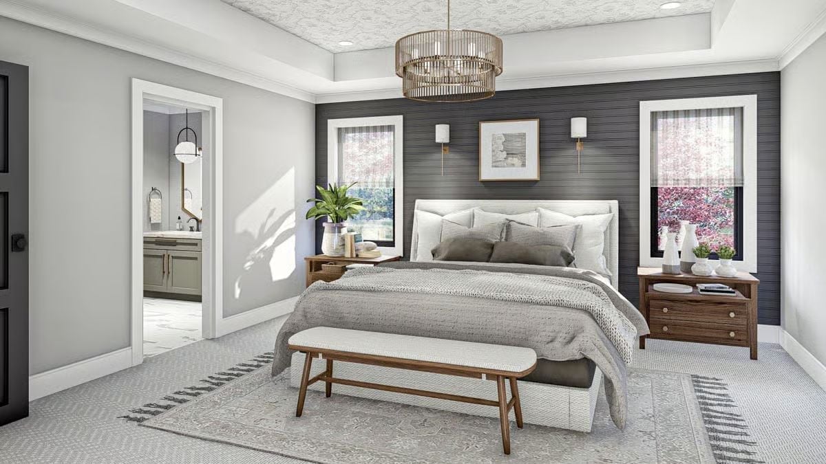 Shiplap Accent Wall and Brass Sconces Give This Primary Suite Its Backbone