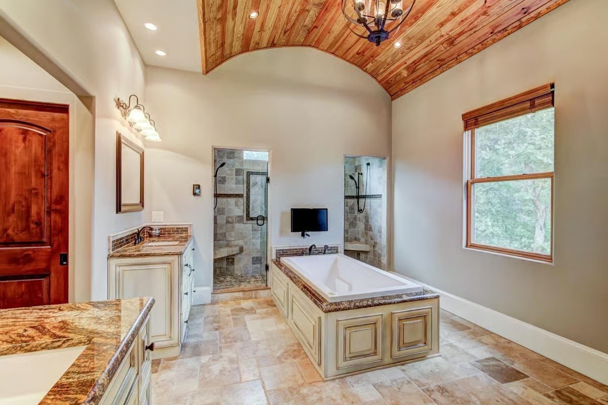 Barrel-Vaulted Cedar Ceiling and Soaking Tub Define a Master Bath Built for Two