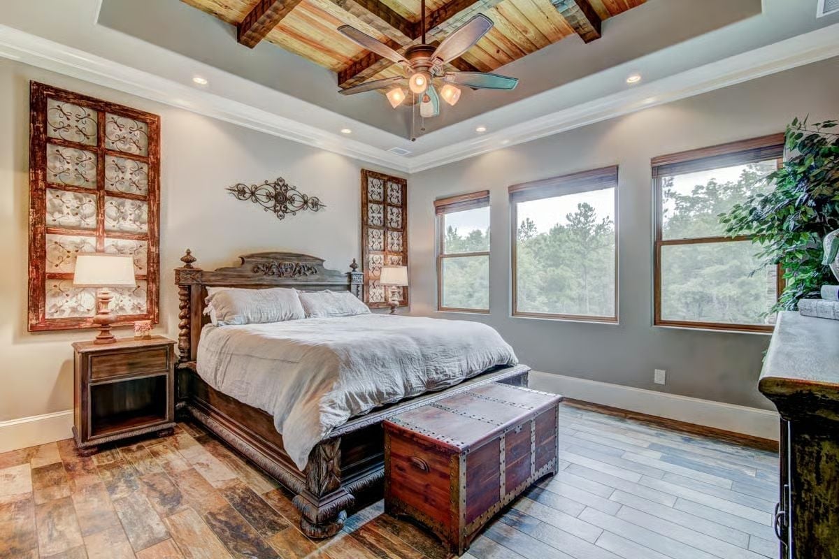 Carved Wood Bed Frame and Coffered Plank Ceiling Pull a Rustic Room Together