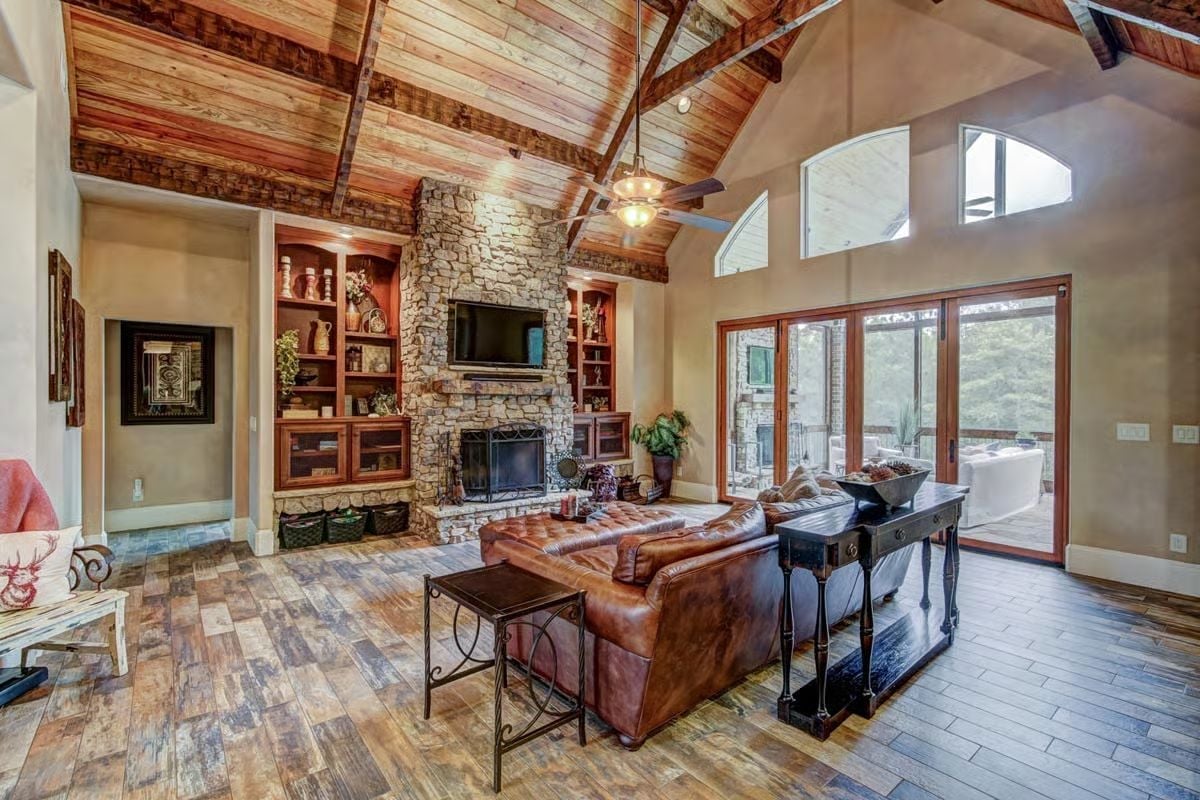 Vaulted Stone Fireplace Wall with Built-Ins Anchors a Room Built to Last