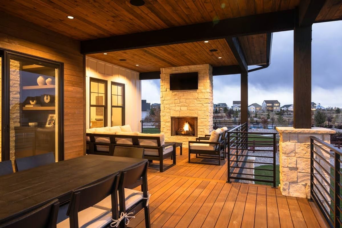Covered Deck with Stone Fireplace and TV Mount Pulls Outdoor Living All the Way In