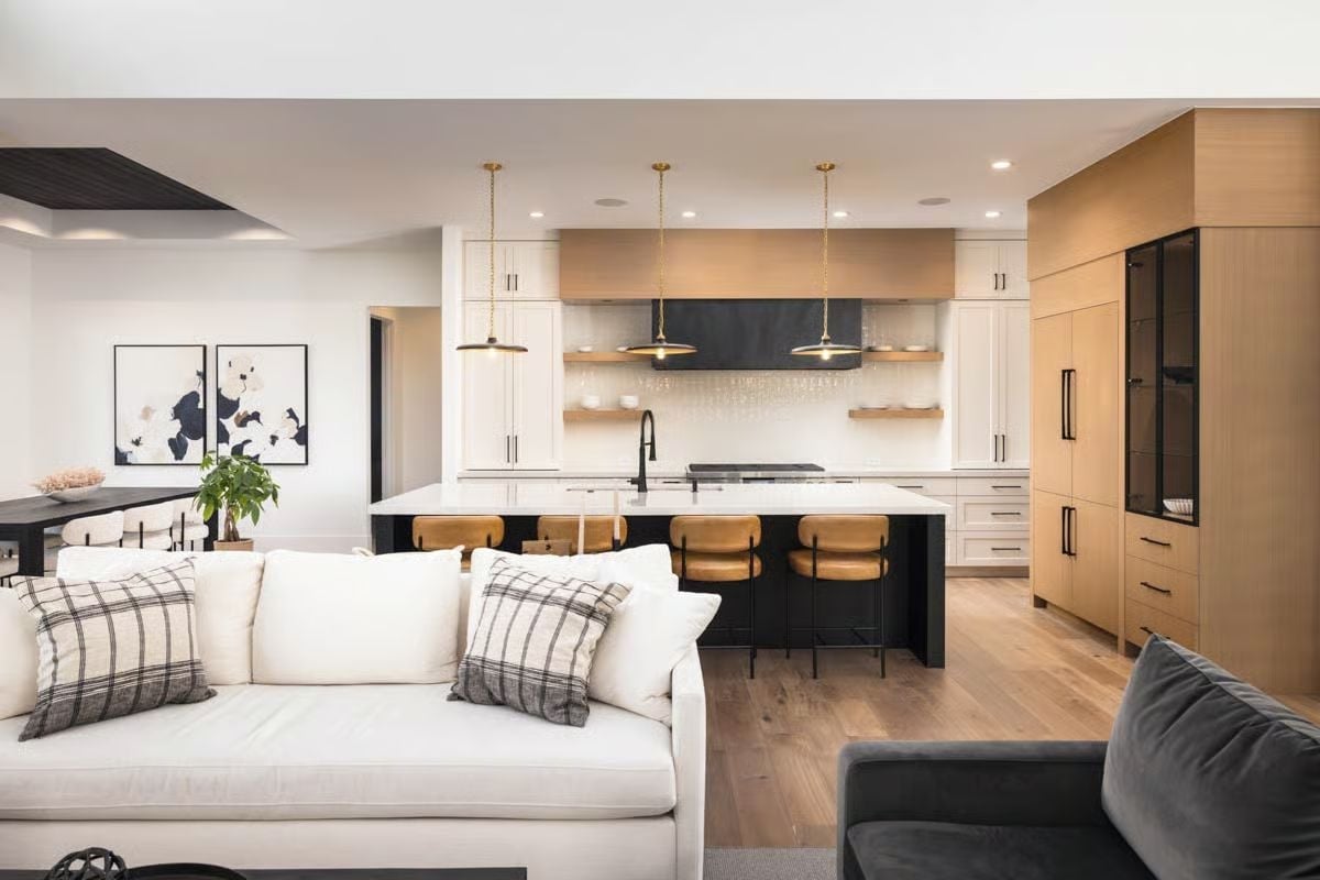 Gold Pendants and Leather Barstools Pull This Open-Plan Kitchen Into Focus