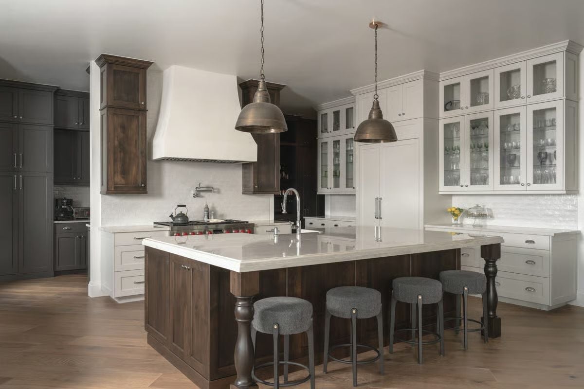 Dark Walnut Island, Brass Pendants, and Three Shades of Cabinet Done Right