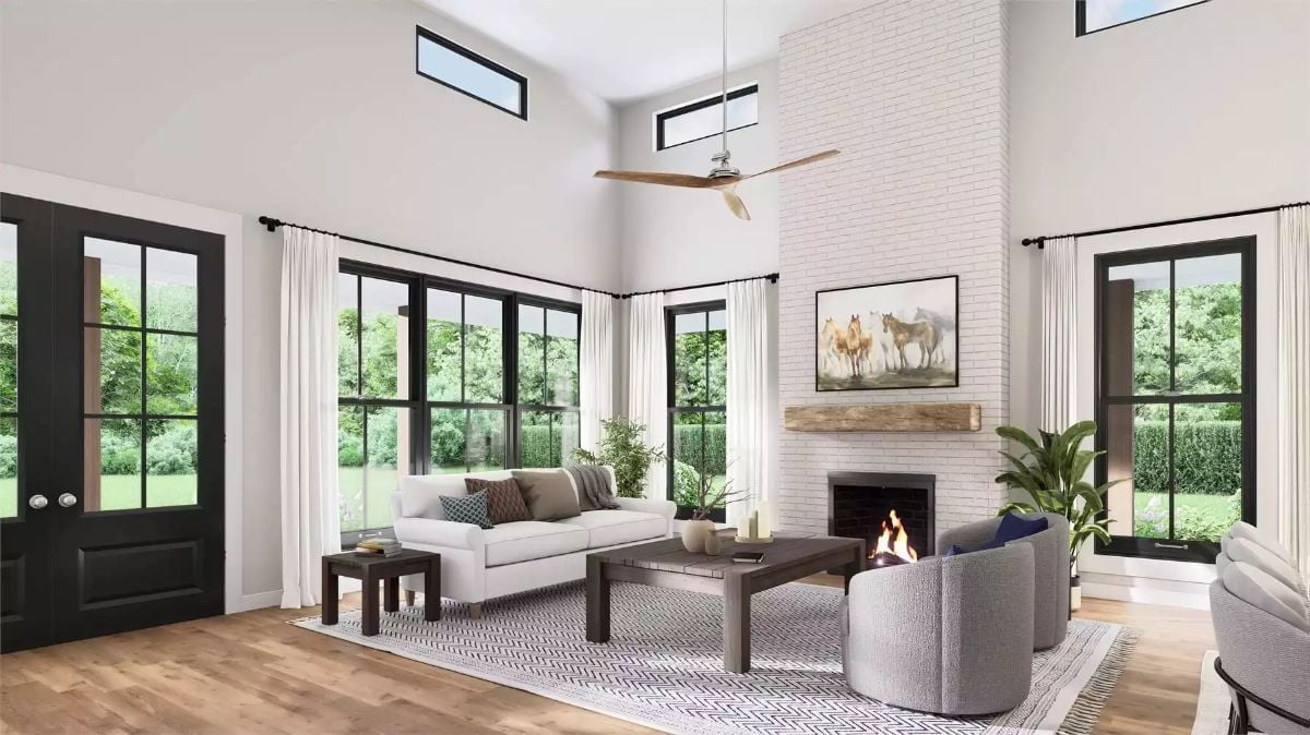 Whitewashed Brick, a Wood Mantel, and Ceiling Height That Earns Its Keep