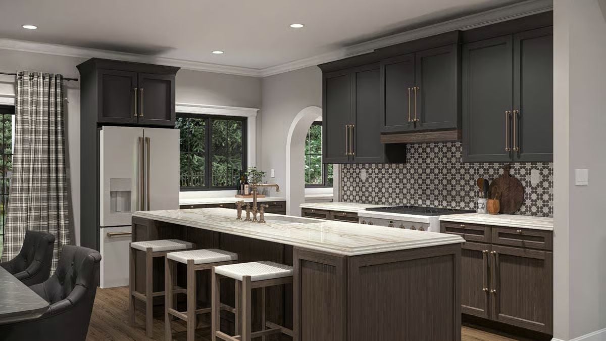 Dark Cabinetry and a Marble Island That Pull the Room Together