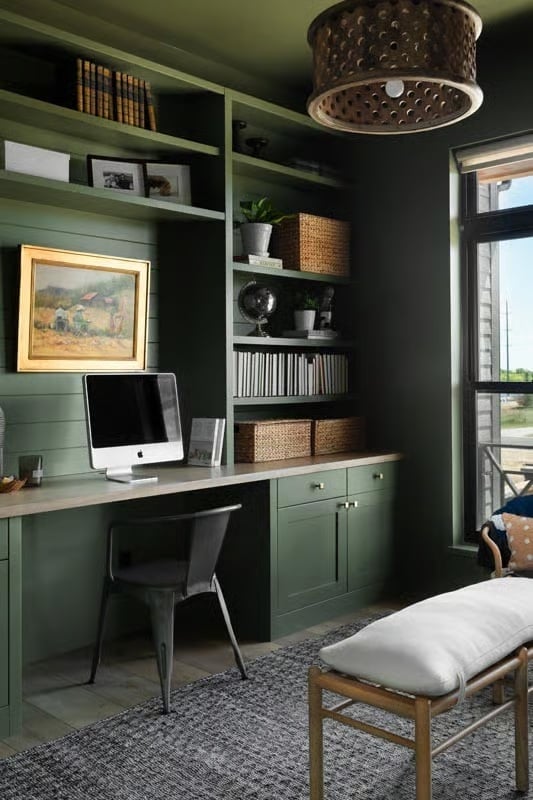Sage Green Built-Ins and a Framed Painting That Holds Its Own Against the Shelves