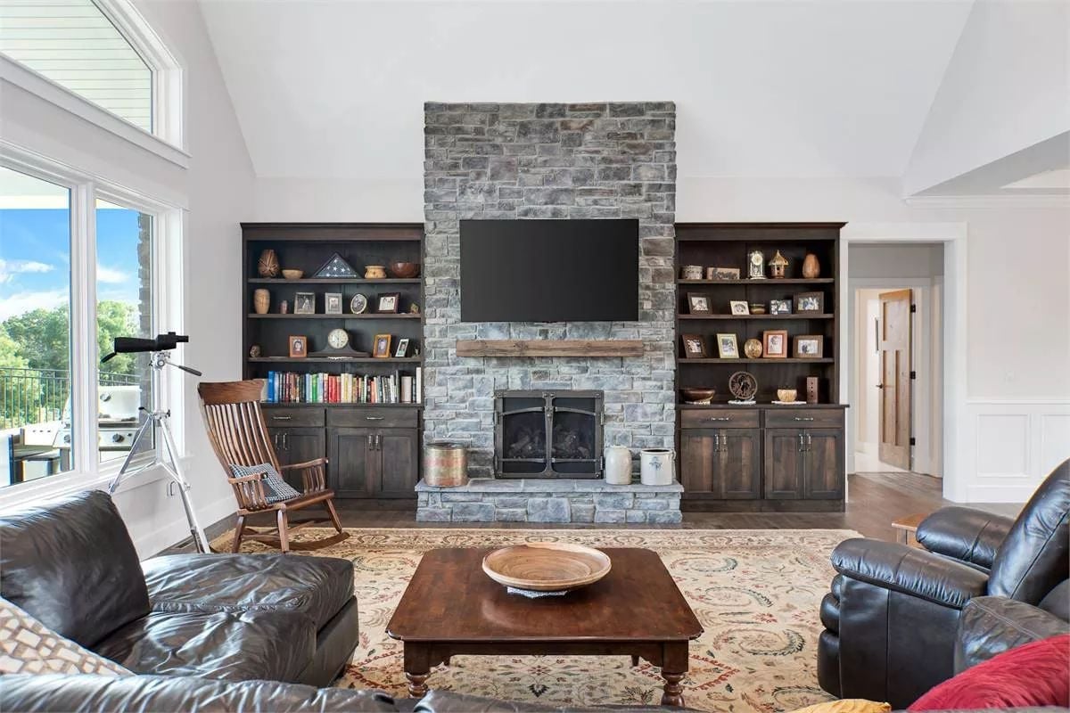Stone Fireplace Wall Earns Its Square Footage With Built-Ins on Both Sides
