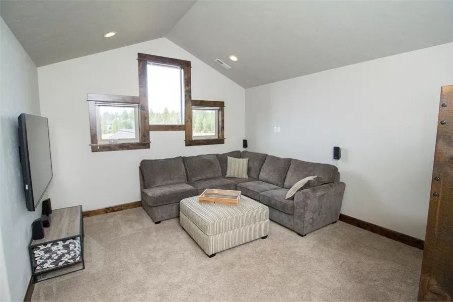 Vaulted Bonus Room Built Around a Sectional and Surround Sound