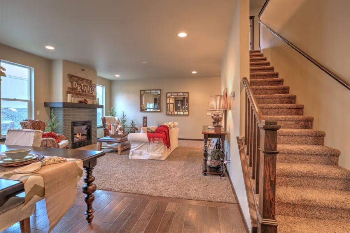 Carpeted Stairs and Hardwood Below Tell You Exactly Where the Zones Begin