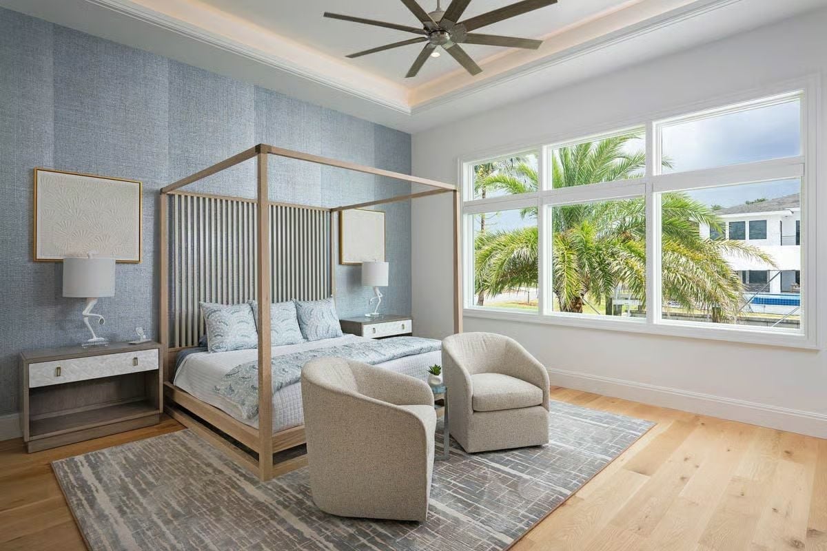 Four-Post Bed, Fluted Headboard, and Palm Trees Framing the View