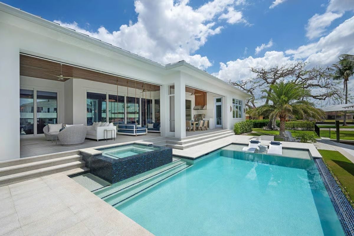 Spa Tub Inset, Geometric Pool Edge, and an Outdoor Living Room That Stays Open Year-Round