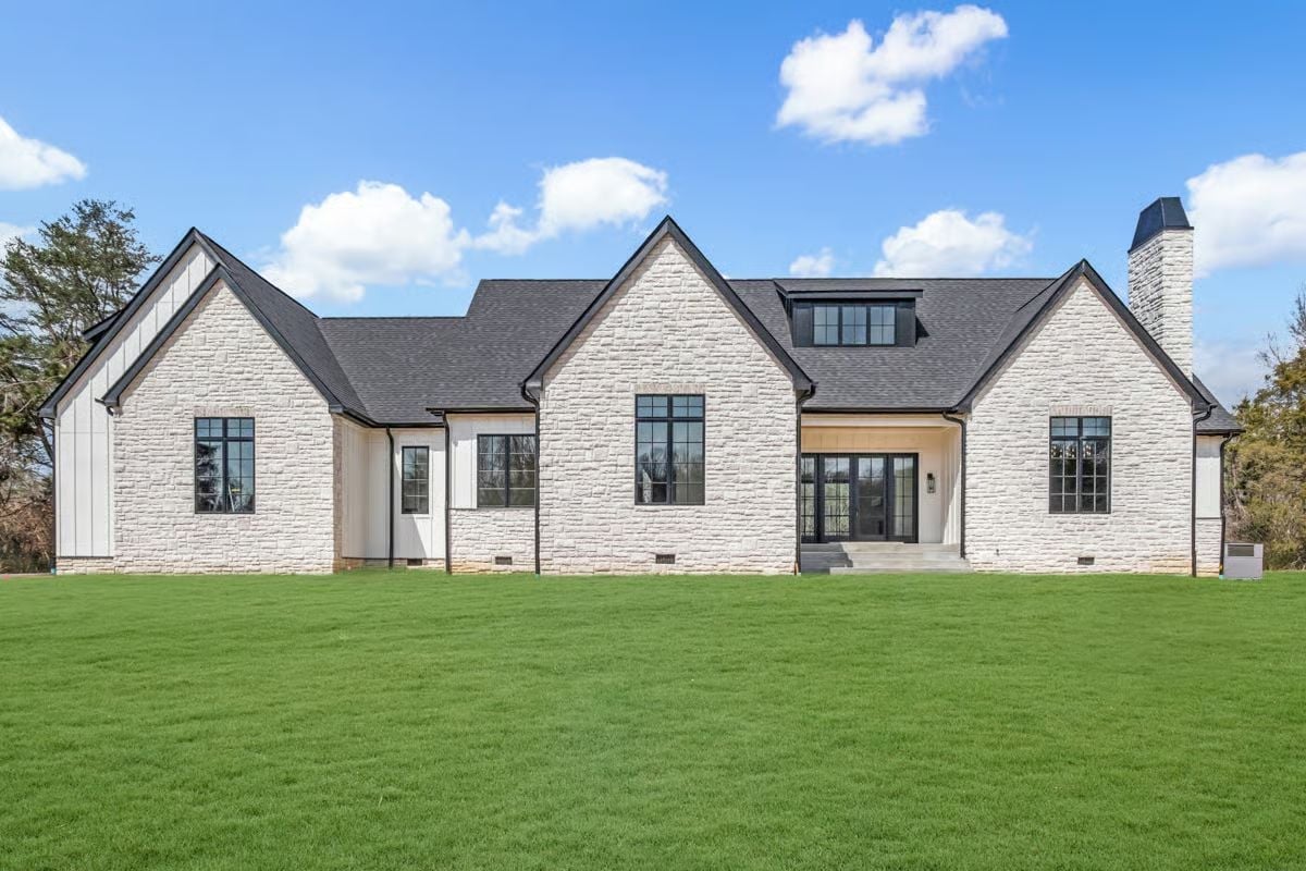 White Limestone Exterior Built for Someone Who Earned Every Square Foot