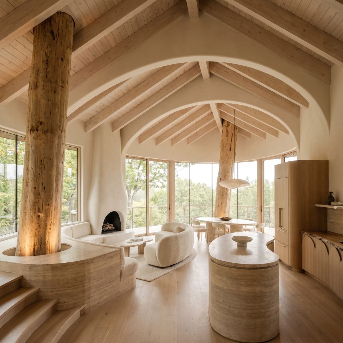 Barrel Vault, Bark Columns, and a Travertine Island That Grounds the Whole Room