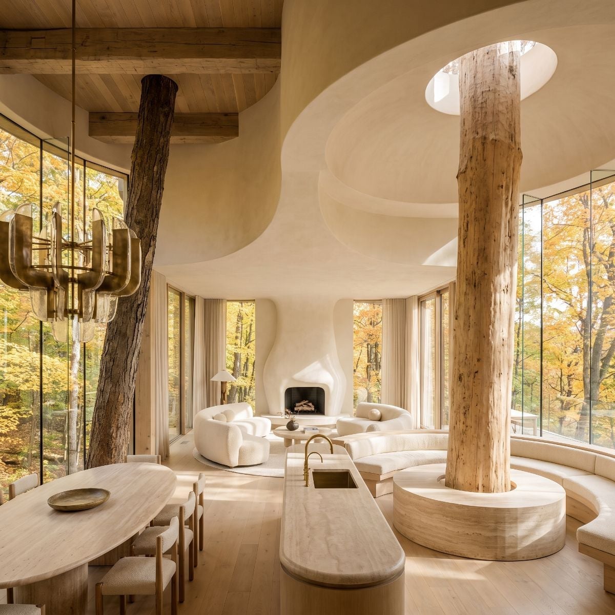 Curved Travertine Bench, Live Columns Through the Ceiling, and Skylight Cutouts That Frame the Canopy