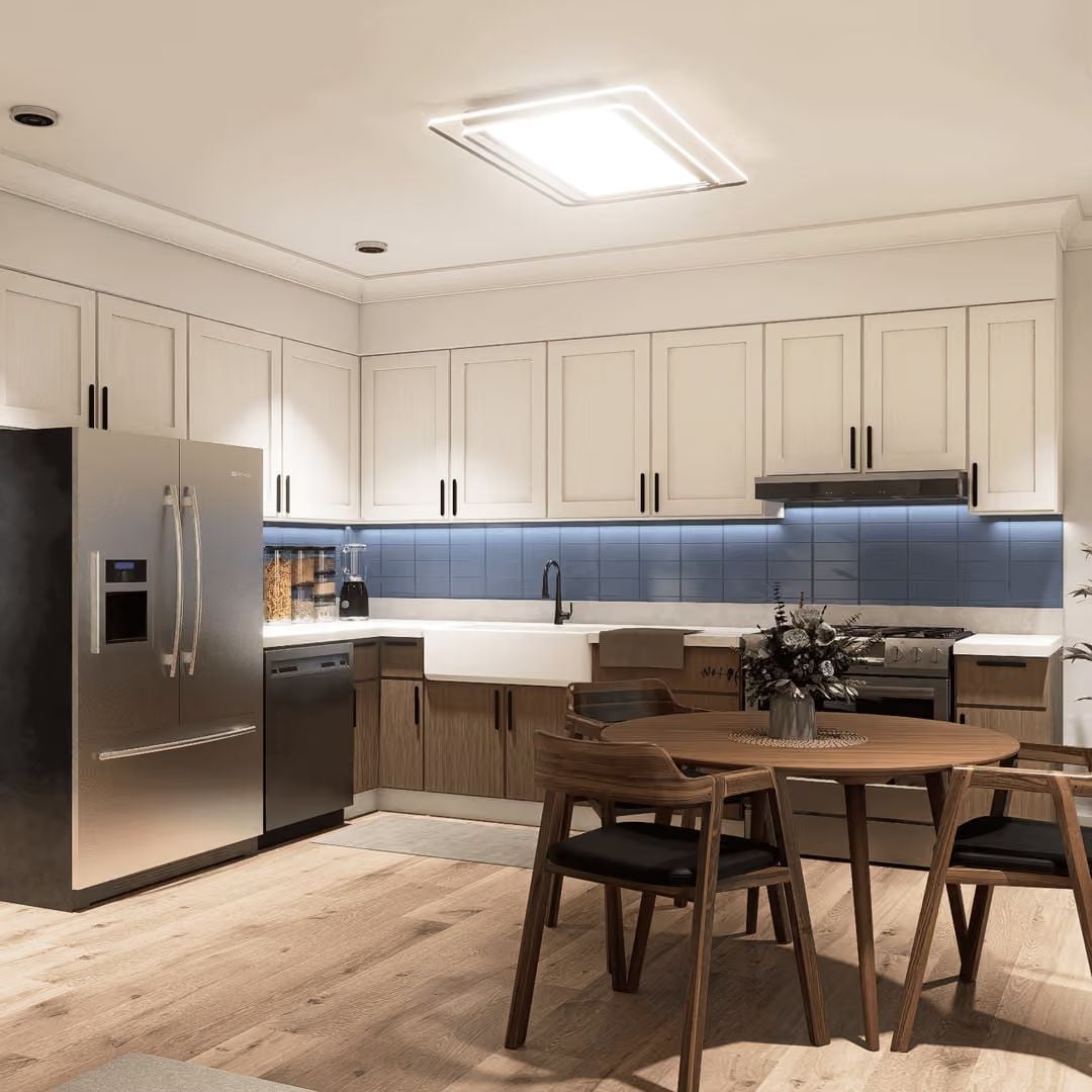 Blue Tile Backsplash and Two-Tone Cabinets Make This Kitchen Worth Spending Time In