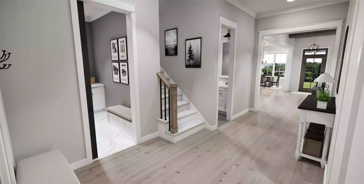 Foyer With Staircase and Mudroom That Pulls Its Weight