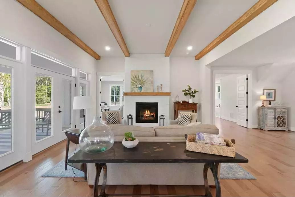 Exposed Beams, a Live Fire, and Sight Lines That Pull the Room Together