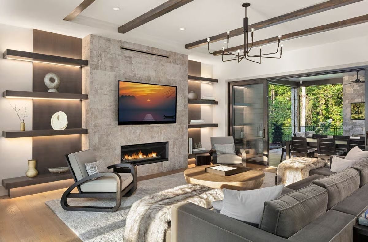 Floating Shelves, a Stone Fireplace Wall, and Exposed Beams Walk Into a Living Room