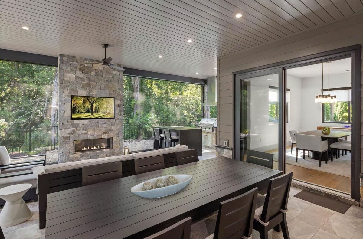 Stone Fireplace, Outdoor Kitchen, and a TV Wall That Pulls It All Together