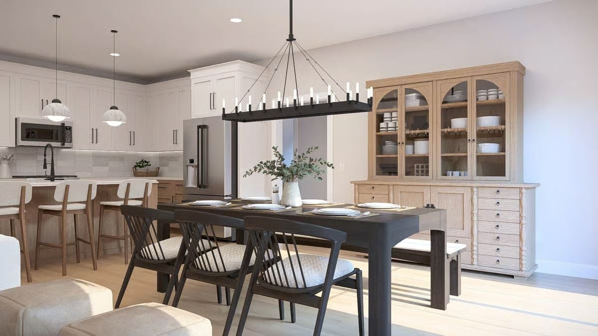 Dark Wood and Candlelight Scale Make This Dining Room Worth Sitting In
