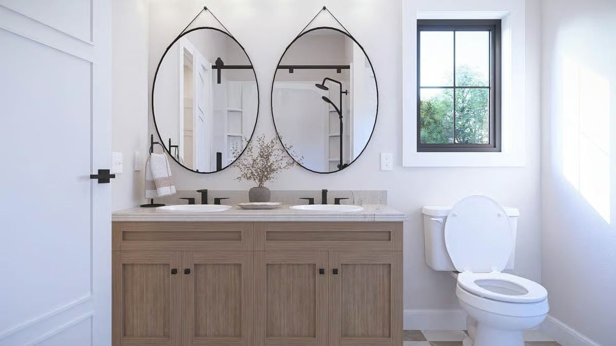 Oval Mirrors on Leather Straps Are Doing the Heavy Lifting in This Double Vanity