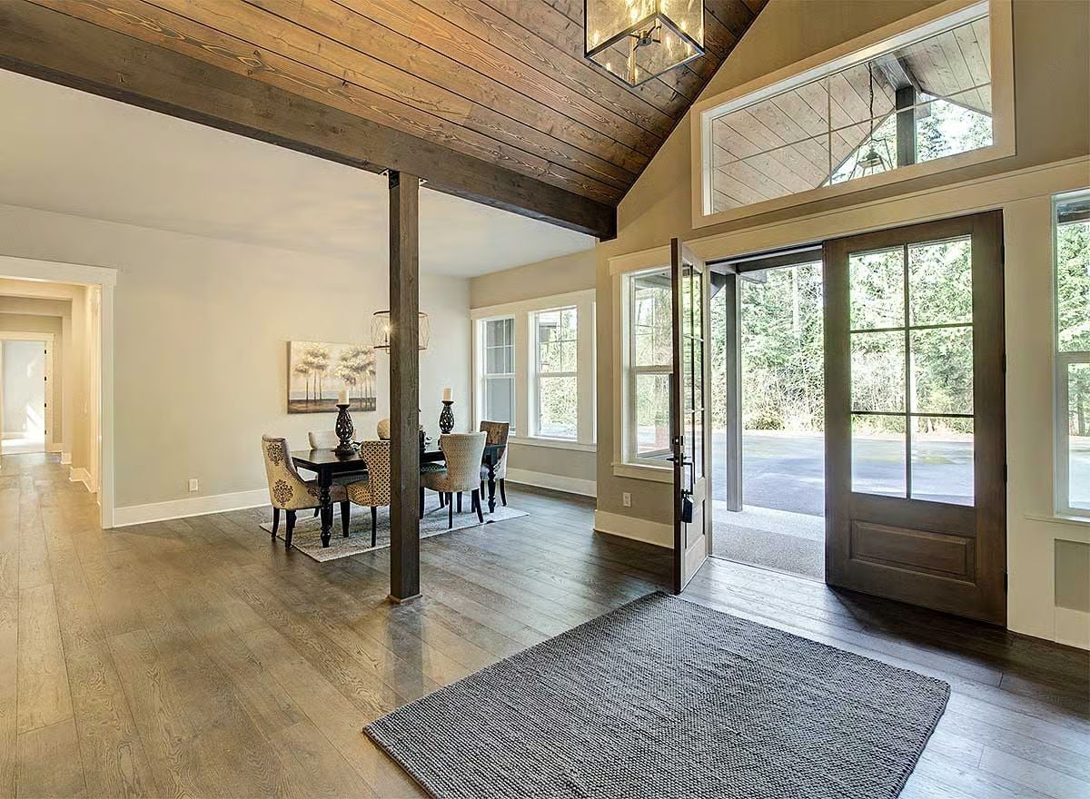 Exposed Beams and Double Doors Make the Entry Worth Walking Through