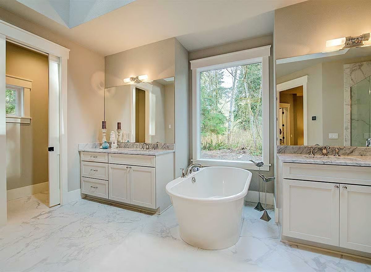 Freestanding Tub Between Dual Vanities Is the Whole Point of This Master Bath
