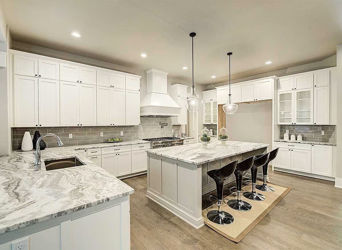 Marble Countertops and Black Barstools Pull This Kitchen in Two Directions at Once