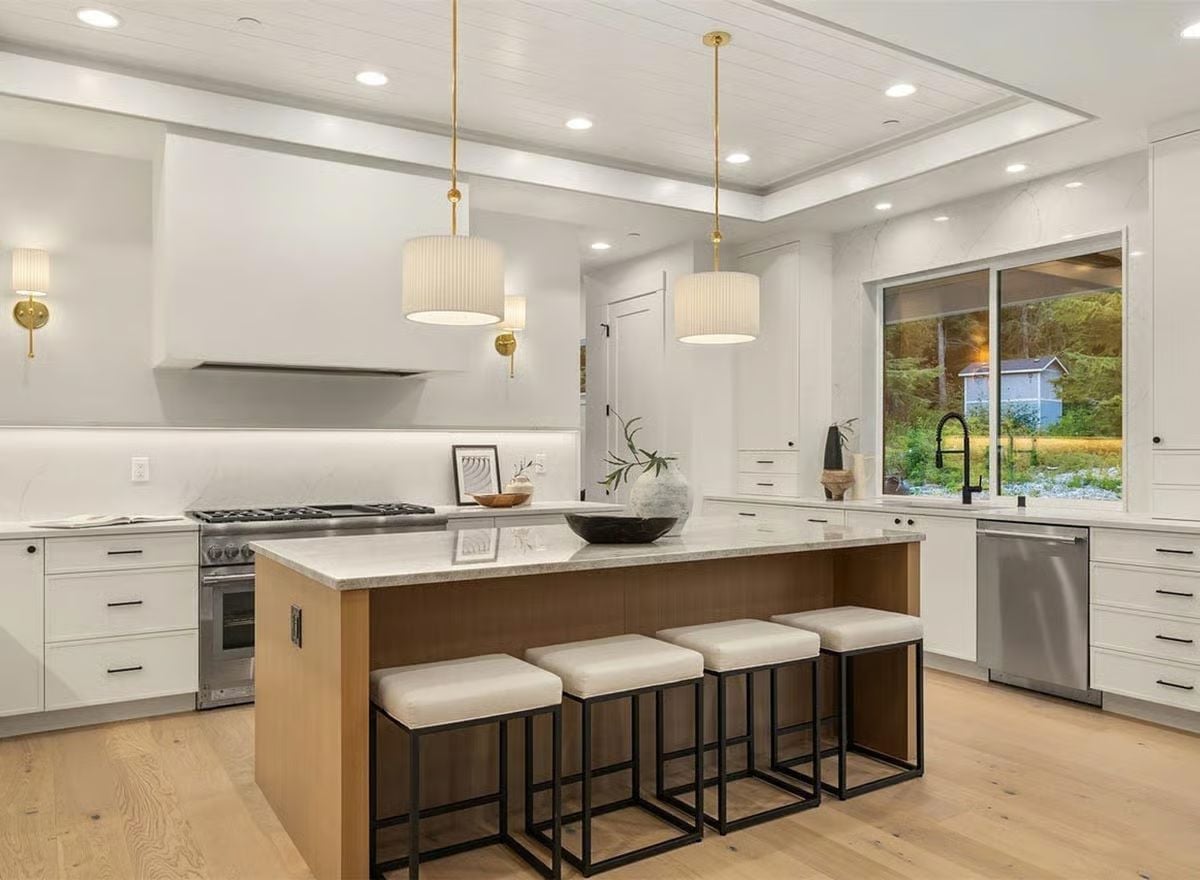 Gold Pendants and a Wood Island Base That Earns Its Place in an All-White Kitchen