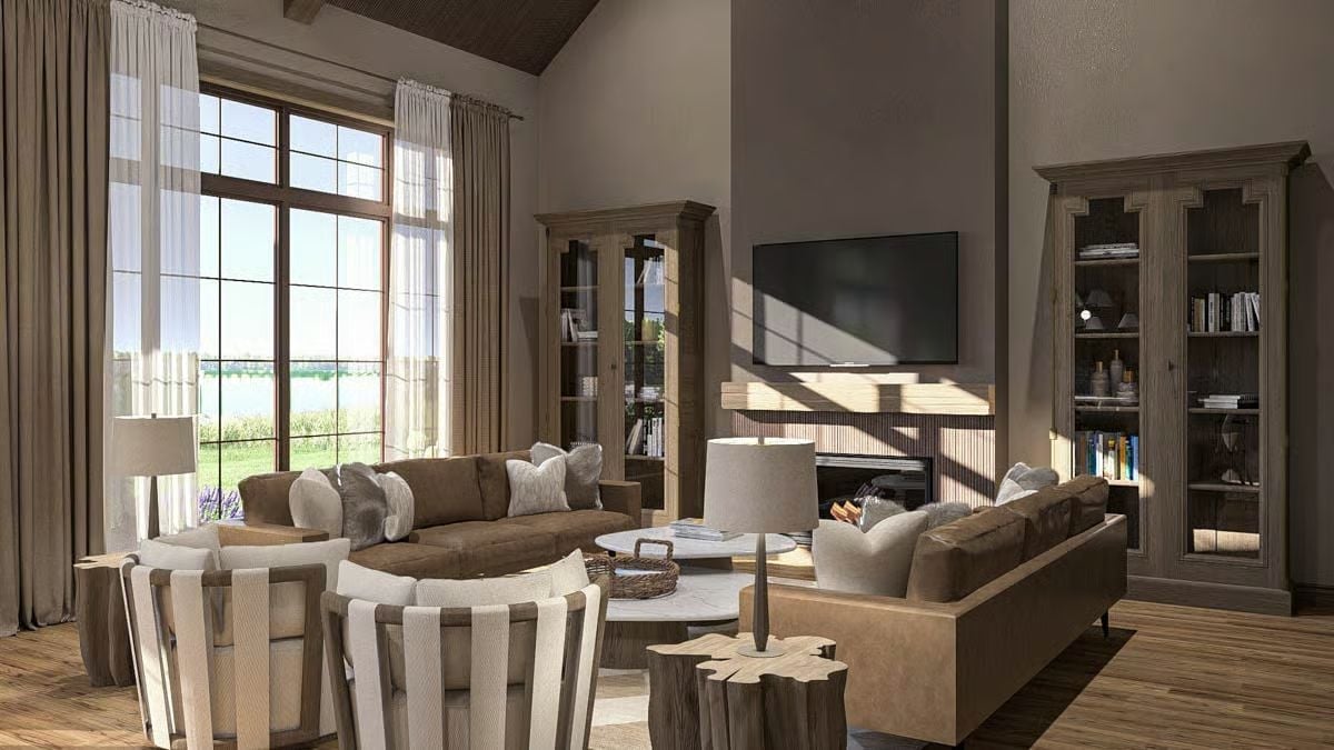 Curved Sofa, Fireplace Glow, and a Lake View That Earns the Real Estate