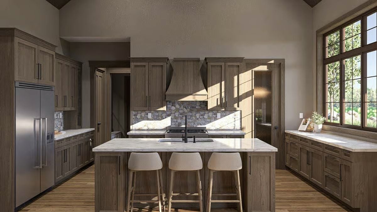 Stacked Stone Backsplash and a Wood Hood Make This Kitchen Feel Earned