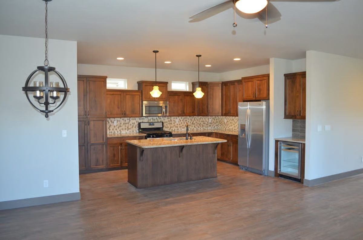 Warm Walnut Cabinets and a Kitchen Island Built for Lingering