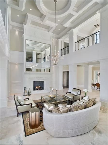 Coffered Ceilings and a Curved Sofa That Owns the Room