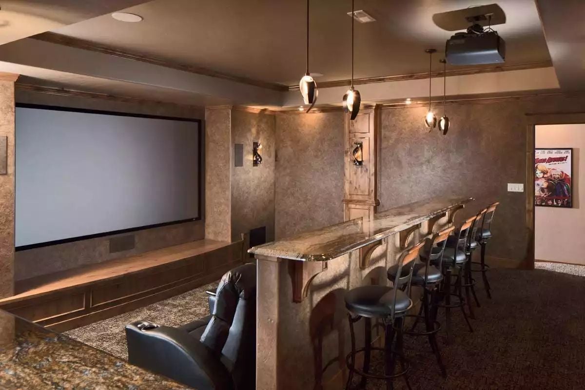 Projector Bar Setup With Granite Counter and Barstools Beats Any Commercial Theater