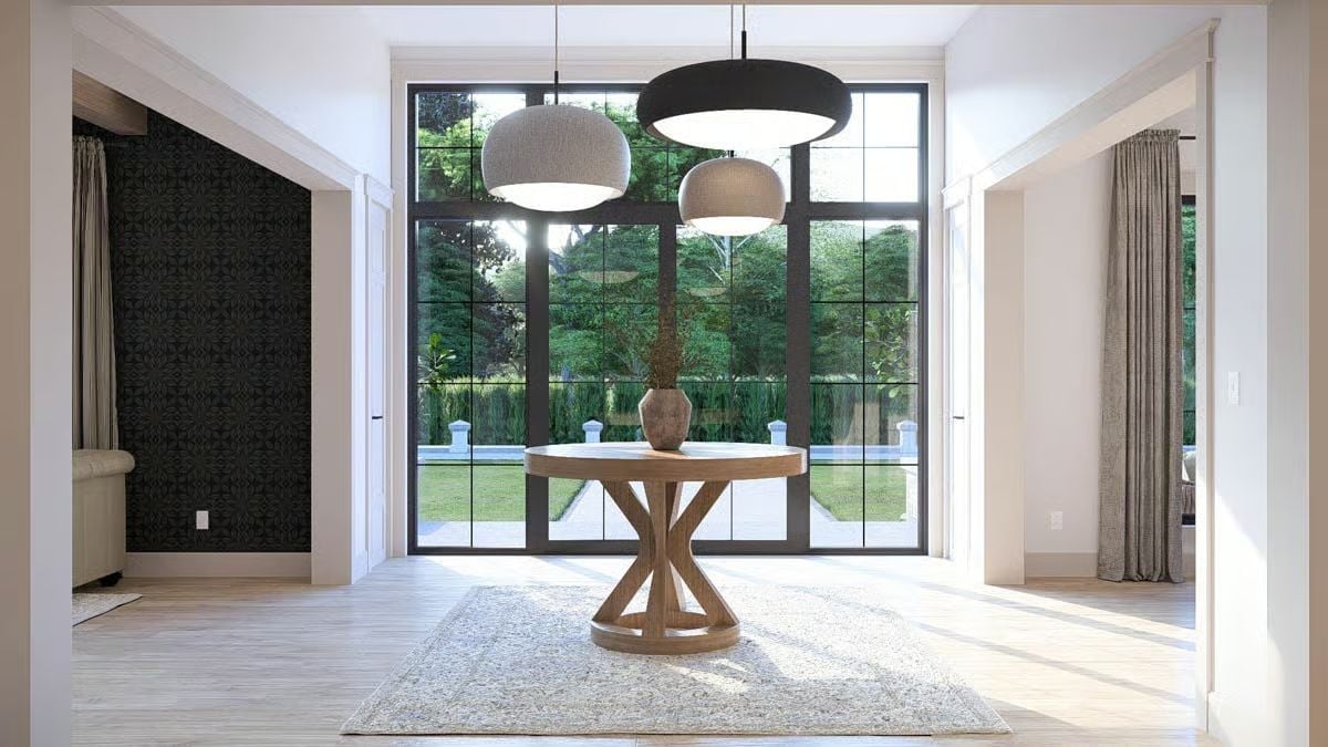 Pendant Cluster Over a Round Entry Table That Knows Exactly What It's Doing