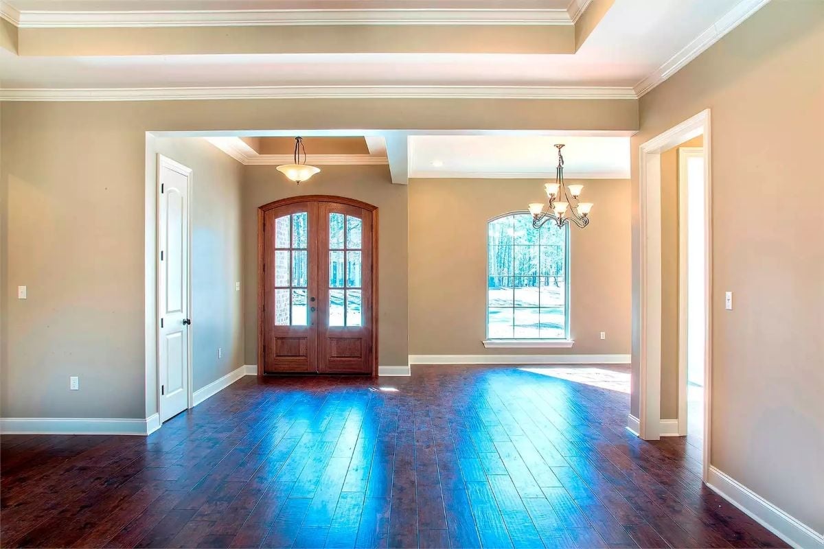 Double French Doors and a Tray Ceiling That Earn Their Keep in an Empty Foyer