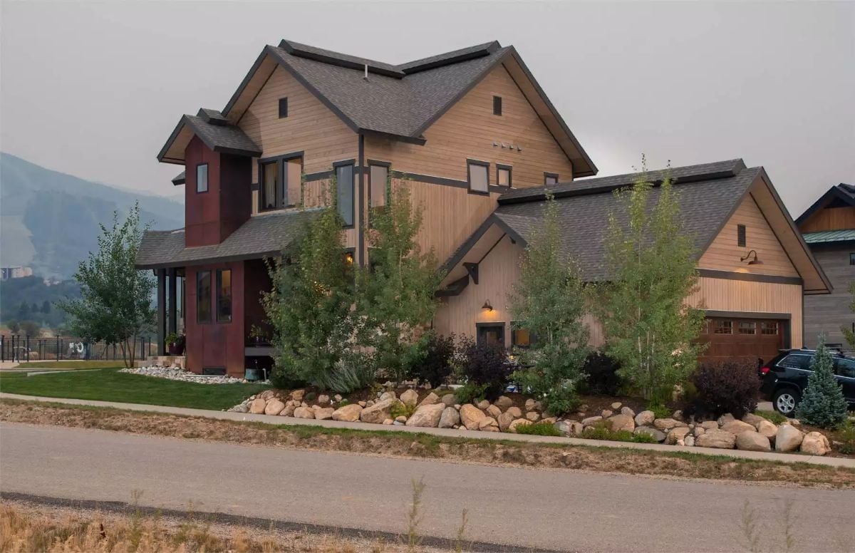 Cedar Siding and Boulder Landscaping Give This Mountain Home Its Character