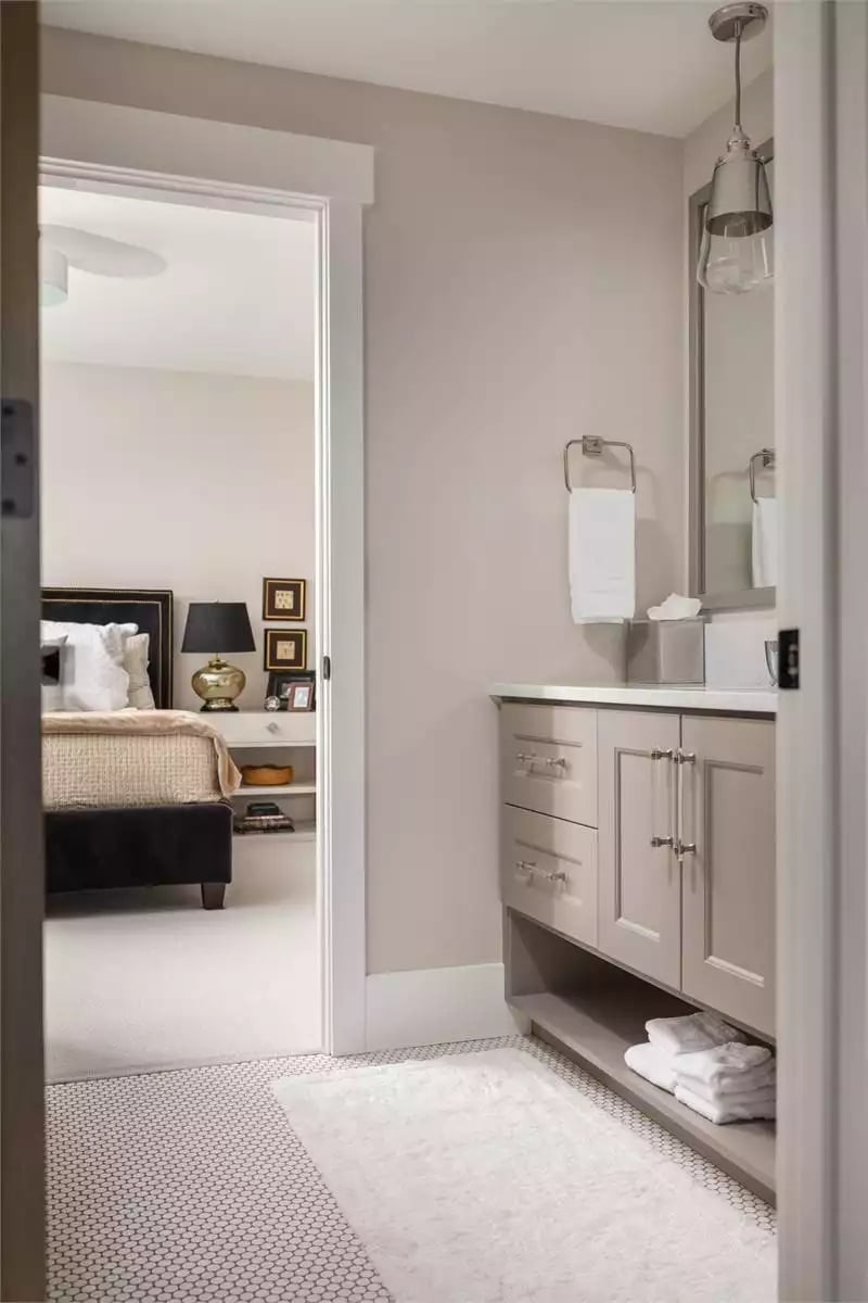 Greige Vanity and Penny Tile in an En Suite That Connects Without Competing