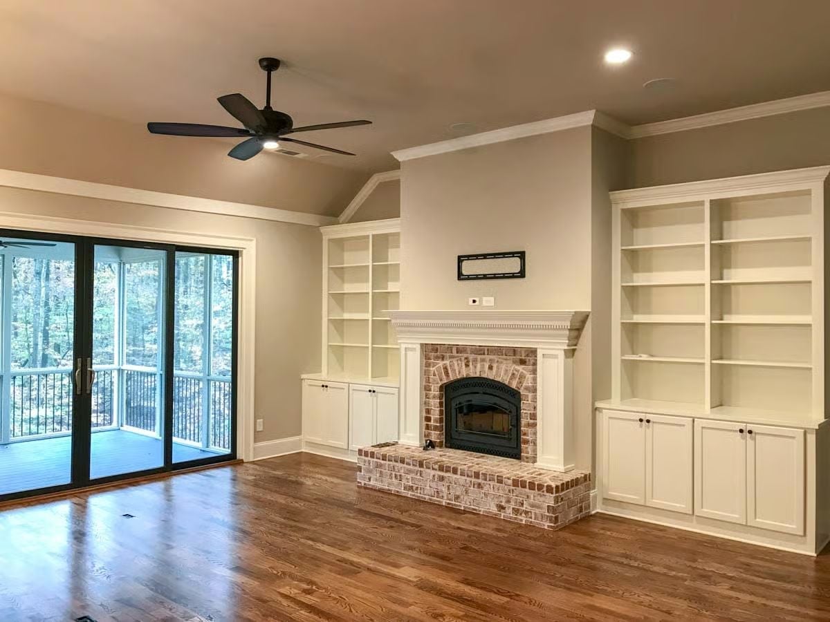 Built-In Bookcases Flanking a Brick Fireplace That Actually Gets Used