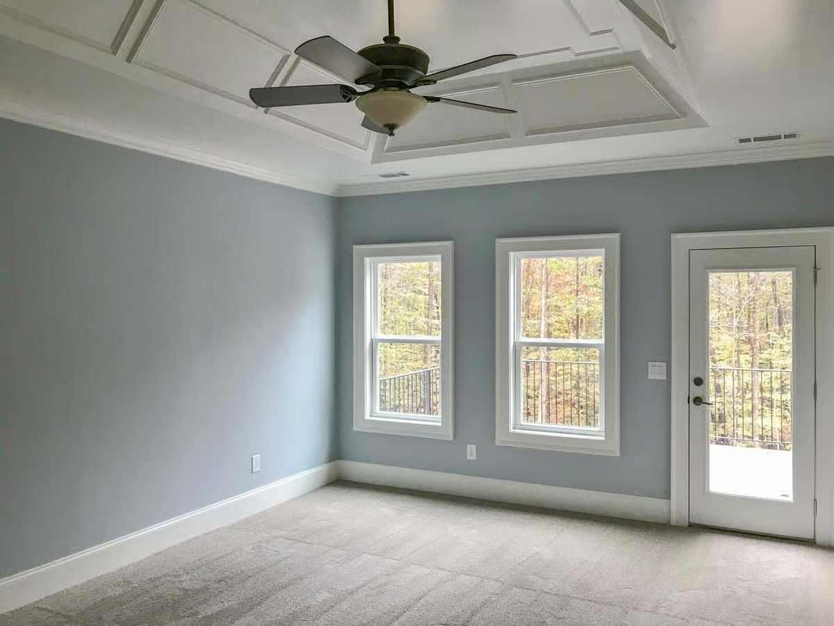 Coffered Ceiling and Gray Walls in a Master Suite Built for Quiet