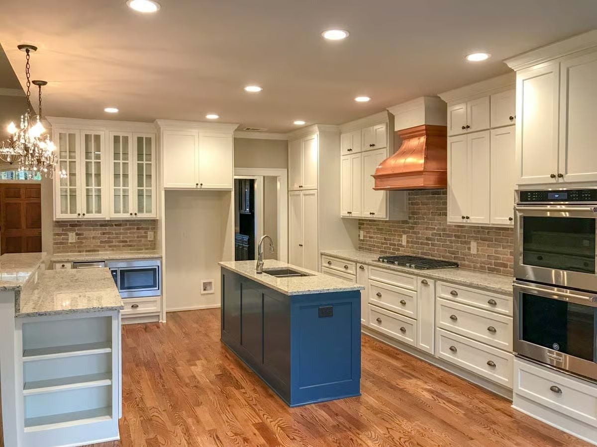 Copper Hood and Navy Island in a Kitchen That Earns Every Compliment